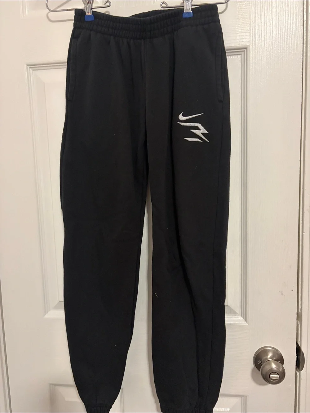 Nike Black Jogger Sweatpants with White Swoosh and Graphic